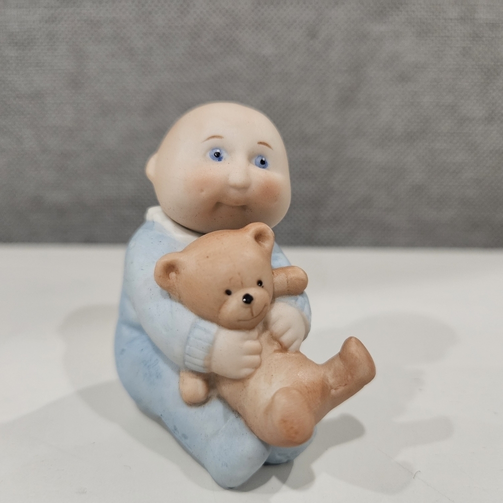 Adorable Blue Baby Figurine with Teddy Bear